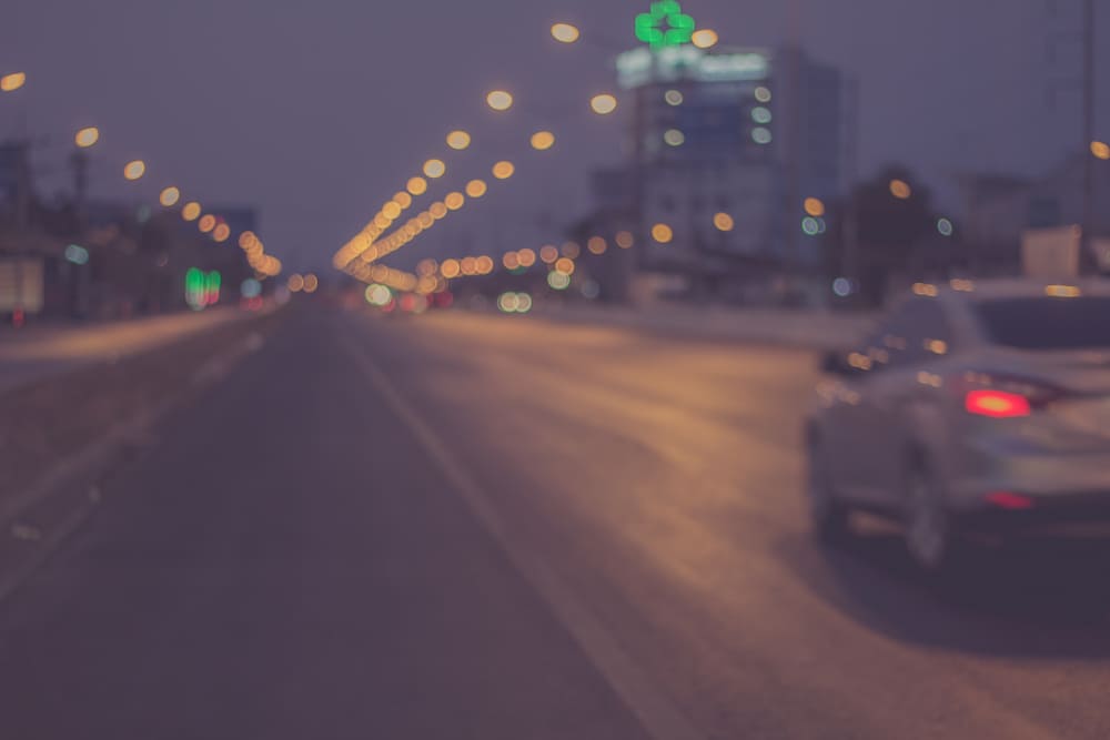 car driving on highway at night