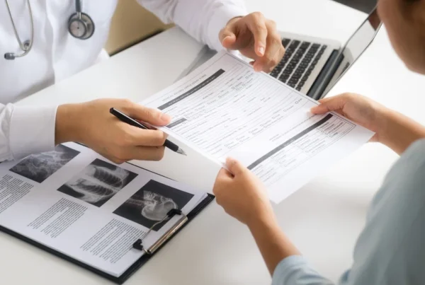 Who is Liable in a Truck Accident? - AK Law Firm Doctor giving a patient their health report